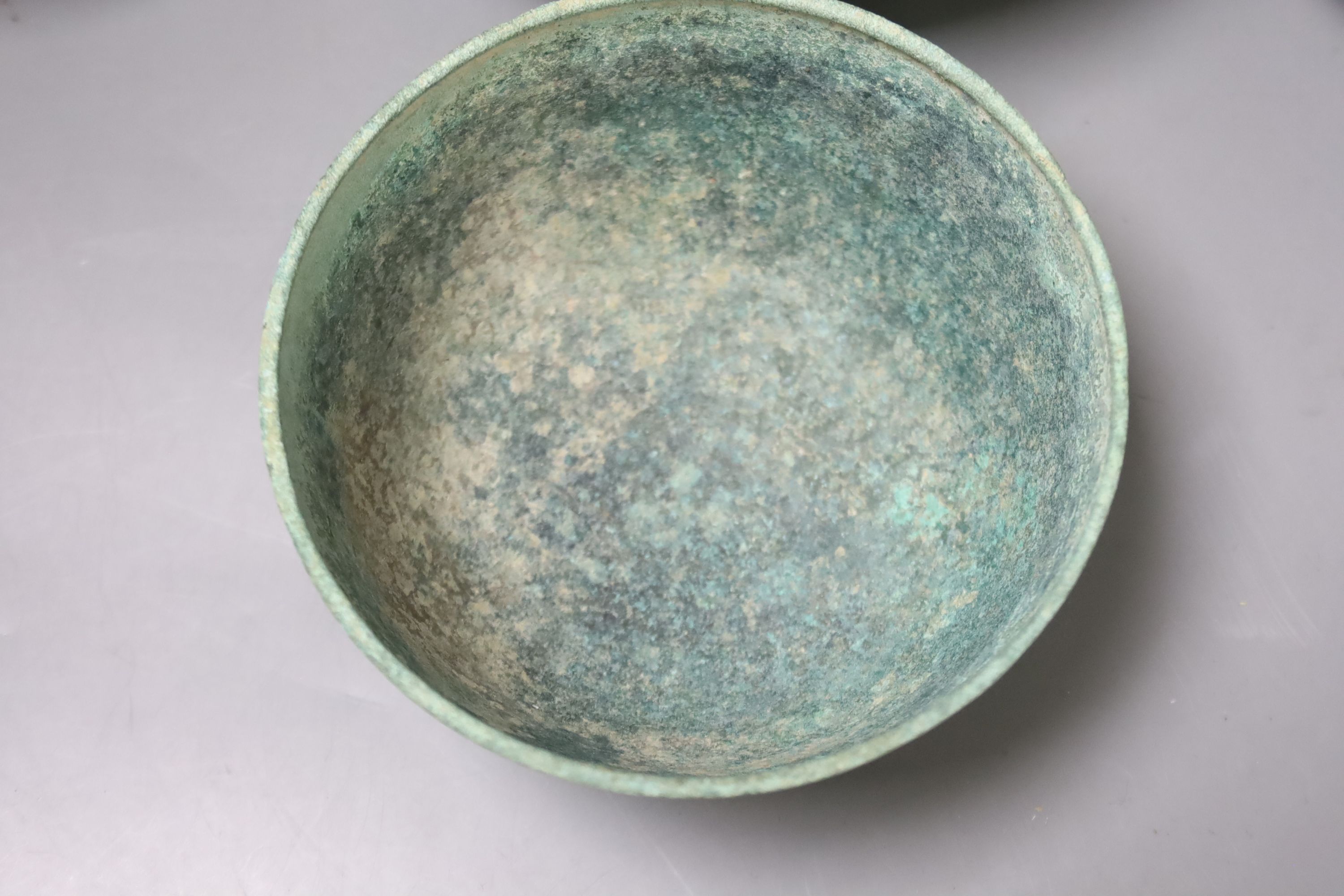 Seven Cambodian bronze ritual offering or water bowls, Khmer, 12th/13th century